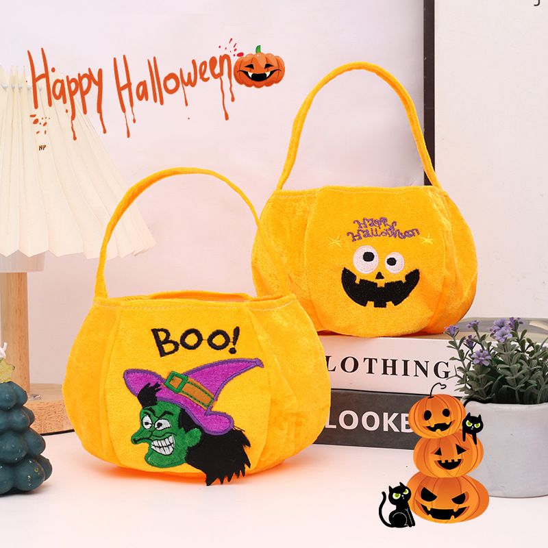Yellow bag with a pumpkin pattern - Plush Halloween Trick or Treat Candy Bag - Polyester Tote with Embroidered Face, Lightweight Portable Goody Pouch — image 2