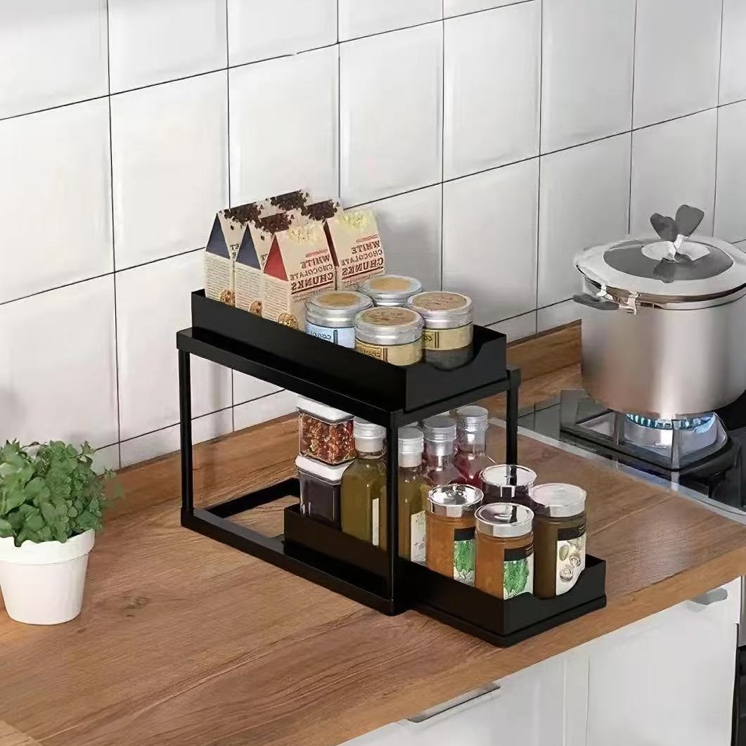 BLACK Two-tier pull-out storage rack. An organizational lifesaver for under the kitchen sink. Features adjustable shelves for easy storage of bottles and jars