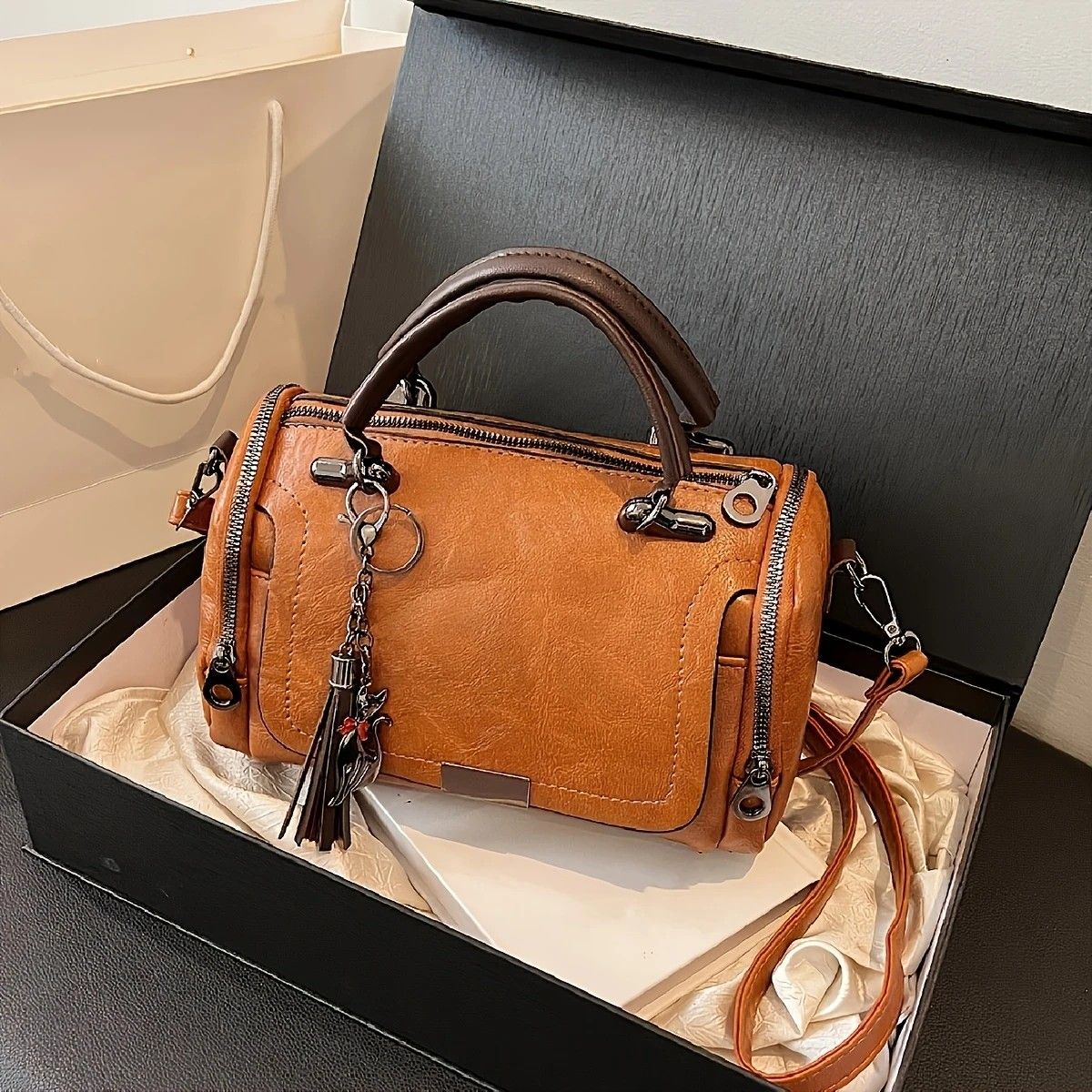 Vintage Tote Bag: Spacious multi-pocket design with tassel and metal accents, supports multiple carrying methods, combining practicality and style..light brown