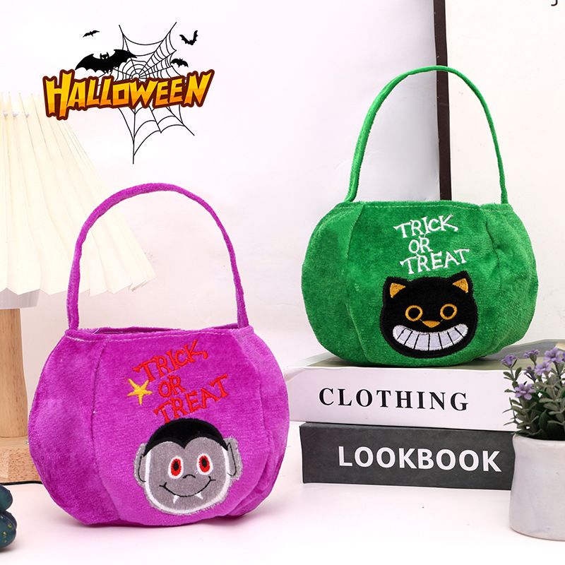 Yellow bag with a pumpkin pattern - Plush Halloween Trick or Treat Candy Bag - Polyester Tote with Embroidered Face, Lightweight Portable Goody Pouch — image 3