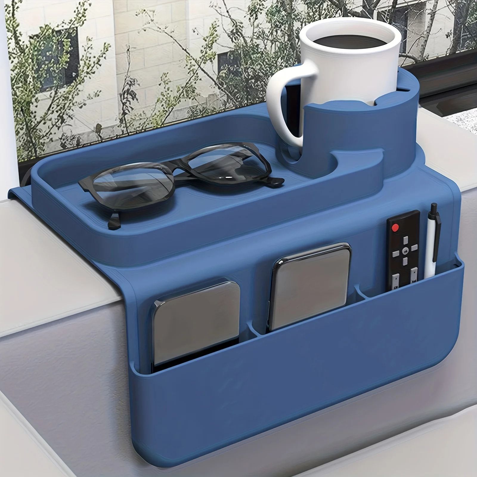 Tidy up your sofa side with this innovative silicone armrest caddy, designed to securely hold your coffee mug, phone, remote, glasses, and keys while you — image 4