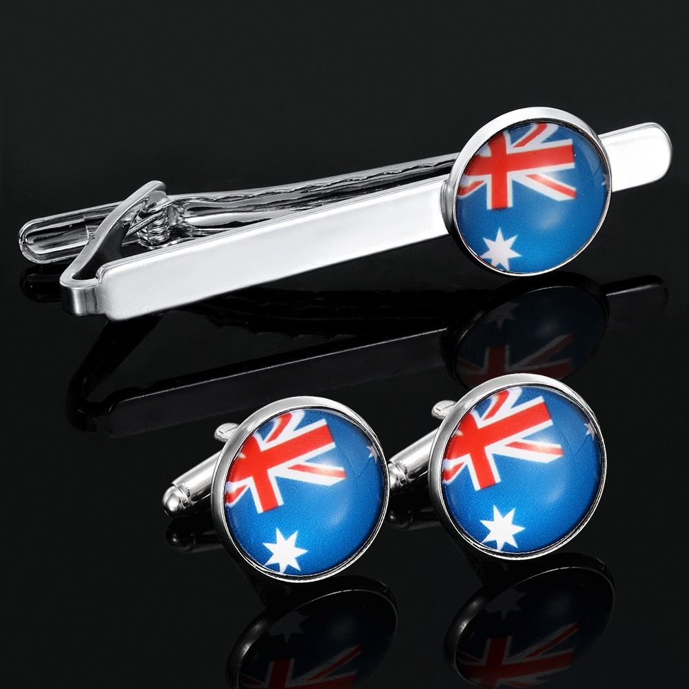Elevate formal style with this sleek tie clip and cufflink set, showcasing vibrant flag-inspired circular enamel inlays on polished silver-toned metal, perfect