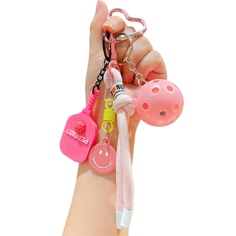 1 Piece Pickleball Keychain Bag Charm - Pink Sports Pendant with Mini Paddle, Ball, Smiley Charm and Woven Cord, Cute Gift Friendly Key Ring for Bags