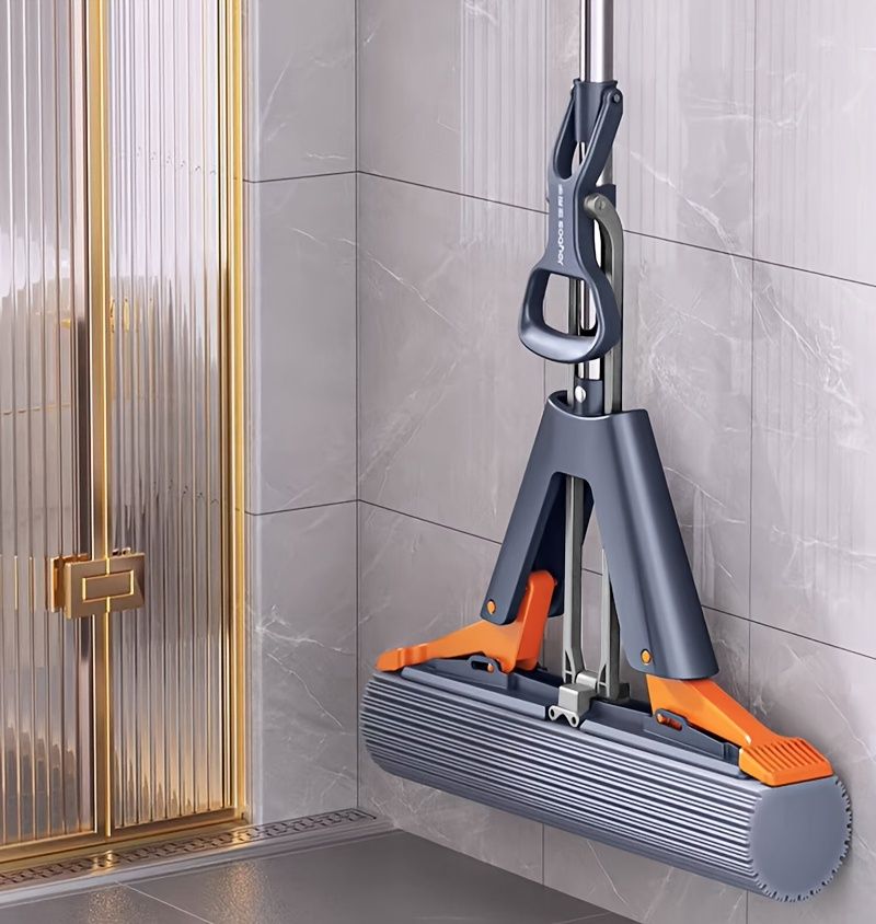 Black self-wringing sponge mop, Australian household mop, floor cleaning tool, comfortable mop, durable sponge mop, spill cleaning, timber floor mop